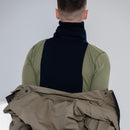Man wearing a genuine Dutch army blue winter neck tube scarf with a khaki jacket draped over shoulders
