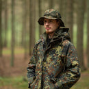 Man wearing Mil-Tec lightweight flecktarn ripstop boonie hat and camo jacket in forest outdoors