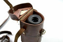Original Yugoslavian army ON-M59 monocular sight tool in worn leather case with strap, vintage military optic.