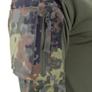 Close-up of TACGEAR Flecktarn camo combat shirt sleeve with ripstop fabric, zippered pocket, and green stretch torso fabric.