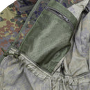 Close-up of inner mesh zippered pocket and adjustable drawstring detail on TACGEAR Flecktarn tactical jacket lining