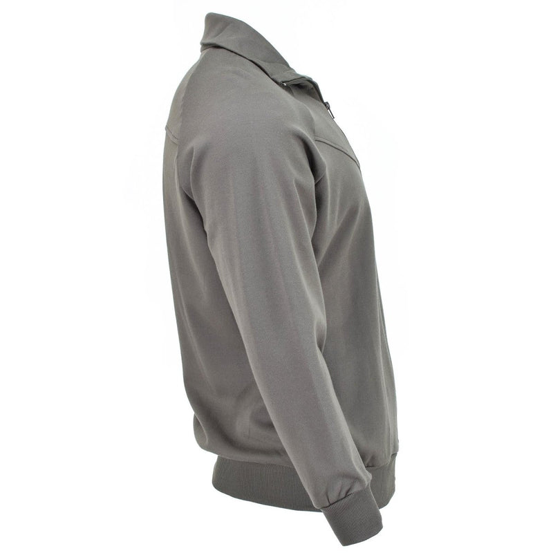 Side view of genuine Austrian Army grey sports jacket with full zip and ribbed cuffs on white background