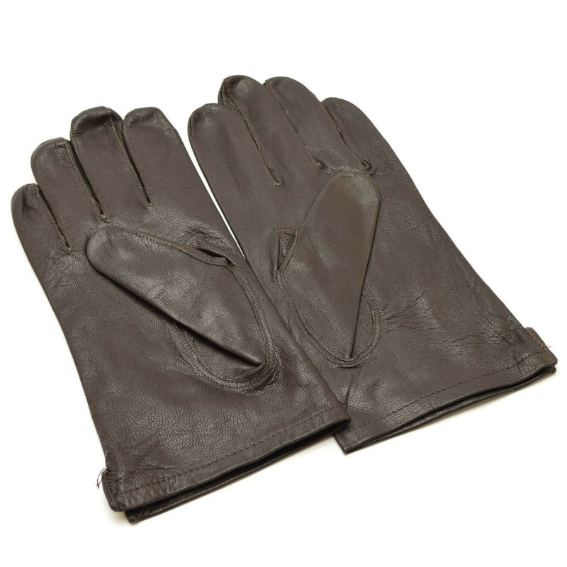 Pair of genuine Belgian army black leather full finger military surplus gloves laid flat on white background