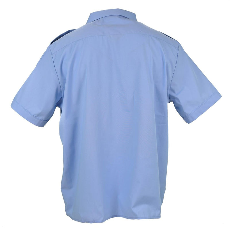 Back view of a genuine French military police blue cotton short sleeve shirt with epaulets and breathable fabric