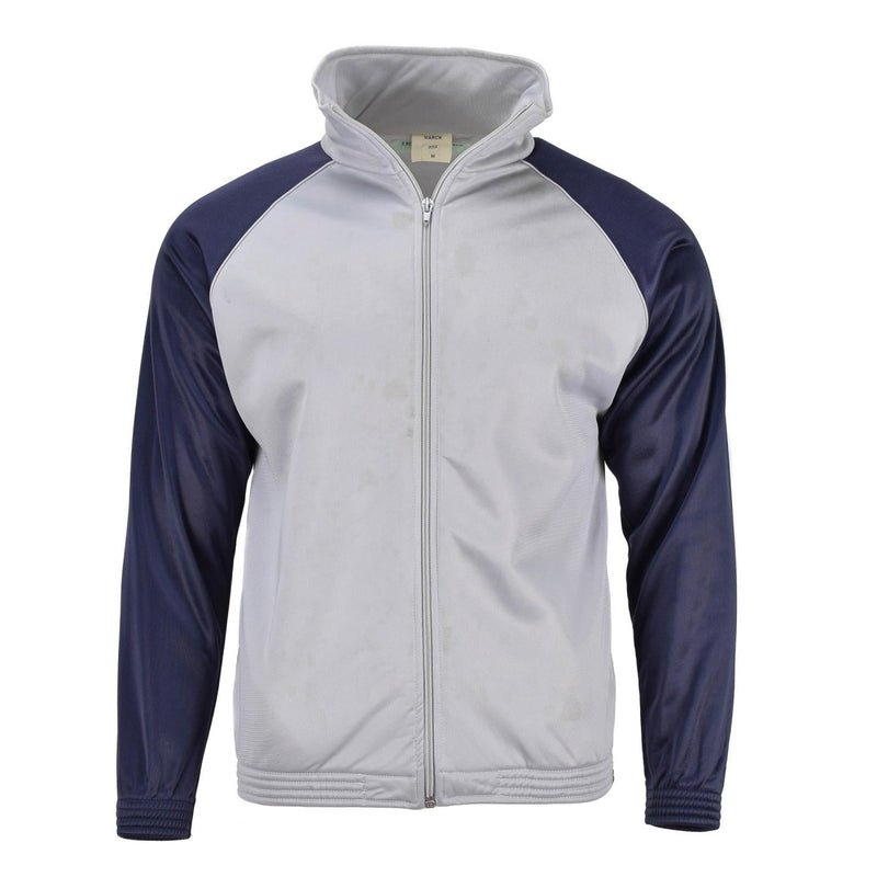 Genuine French Military school track jacket with grey body, navy sleeves, full zip, and elastic cuffs and waistband.