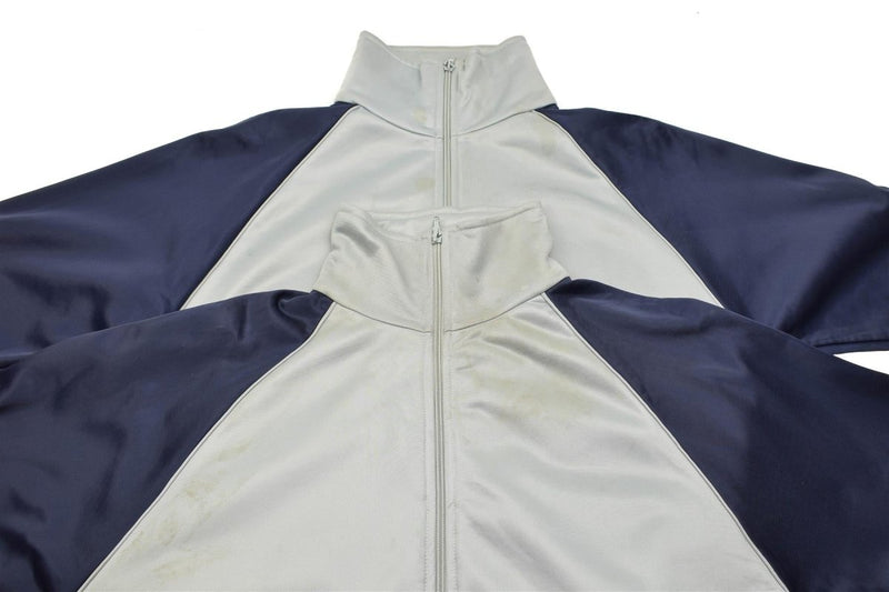 Light grey and navy blue French military school sweatshirt with front zipper and high collar, laid flat on white background