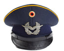 Vintage German Luftwaffe Air Forces peaked visor cap in blue with military insignia and black leather visor