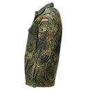 Side view of a women's genuine German military Flecktarn camo field shirt with snap buttons and flag patch