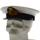 White Genuine Italian Navy peaked cap with gold insignia and black leather chinstrap on skull model