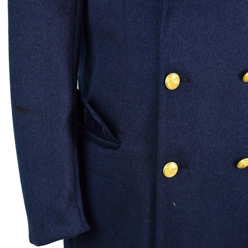Close-up of genuine Italian army blue wool overcoat with gold military buttons and side pocket detail.