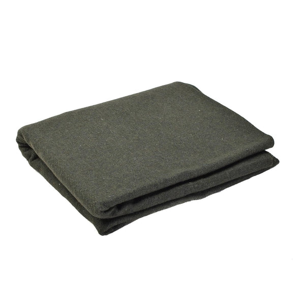 Folded dark green blanket on a white background