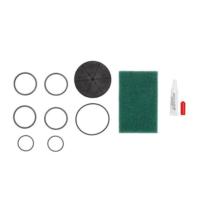 Katadyn Vario water filter maintenance kit with spare o-rings, cleaning pad, lubricant tube, and seal components.