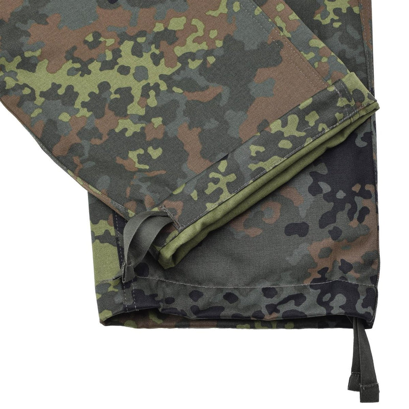 Close-up of Leo Kohler Bundeswehr Flecktarn camo tactical BDU pants showing reinforced hems and drawstrings.
