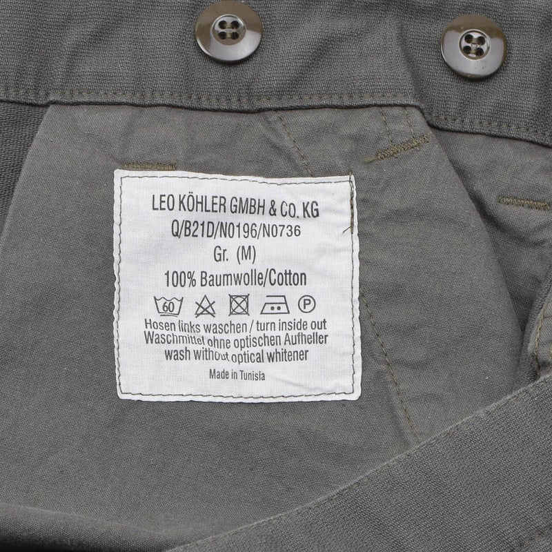 Close-up of Leo Kohler military bermuda shorts cotton label showing size, care instructions, and country of origin.