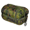 Rolled MFH 2-layer lightweight sleeping bag in M05 camouflage with compression straps and drawstring for compact storage.