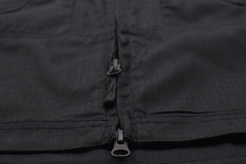Close-up of black ripstop fabric with a heavy-duty zipper on a narrow fit Mil-Tec military style jacket.