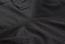 Close-up of black Mil-Tec tactical combat shirt fabric showing mesh ventilation and reinforced stitching details.