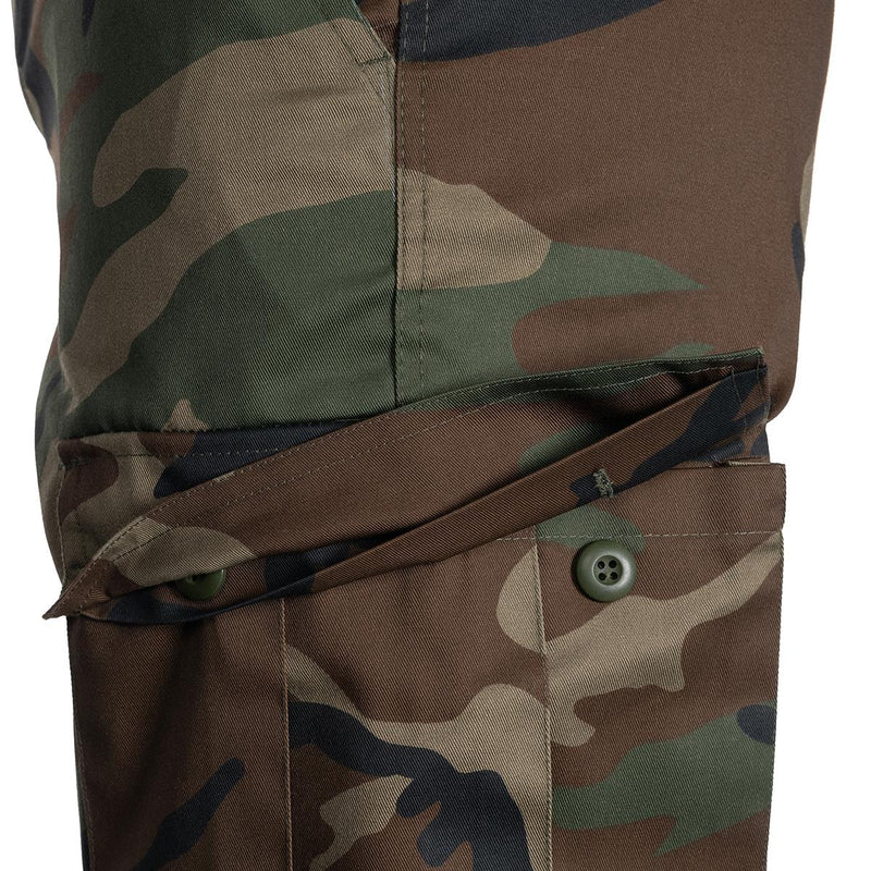 Close-up of Mil-Tec military style woodland camouflage cargo pocket on Bermuda shorts with button flap.