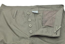 Close-up of olive green Mil-Tec ripstop cargo pants with button fly and reinforced stitching.