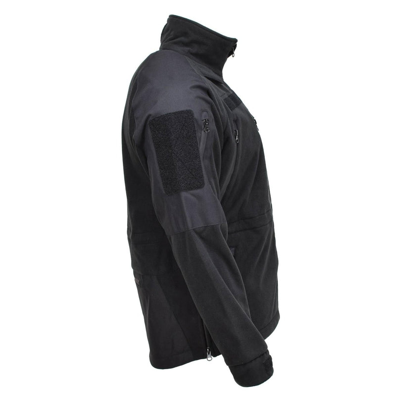 Black MIL-TEC fleece jacket with water-resistant, thermal fabric designed for cold weather and active outdoor use.