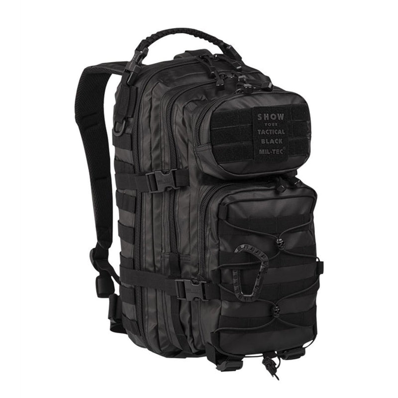 Black MIL-TEC U.S. Assault tactical backpack 20L with multiple compartments and adjustable padded straps for hiking and camping.