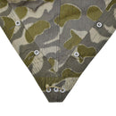 Detail of corner ties and buttons on vintage Austrian army pea dot splinter camo poncho tent fabric