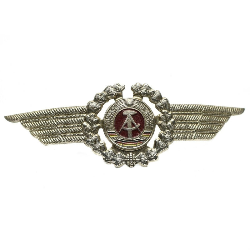 Original East German NVA DDR military officer cap cockade pin badge with silver wings and red emblem center