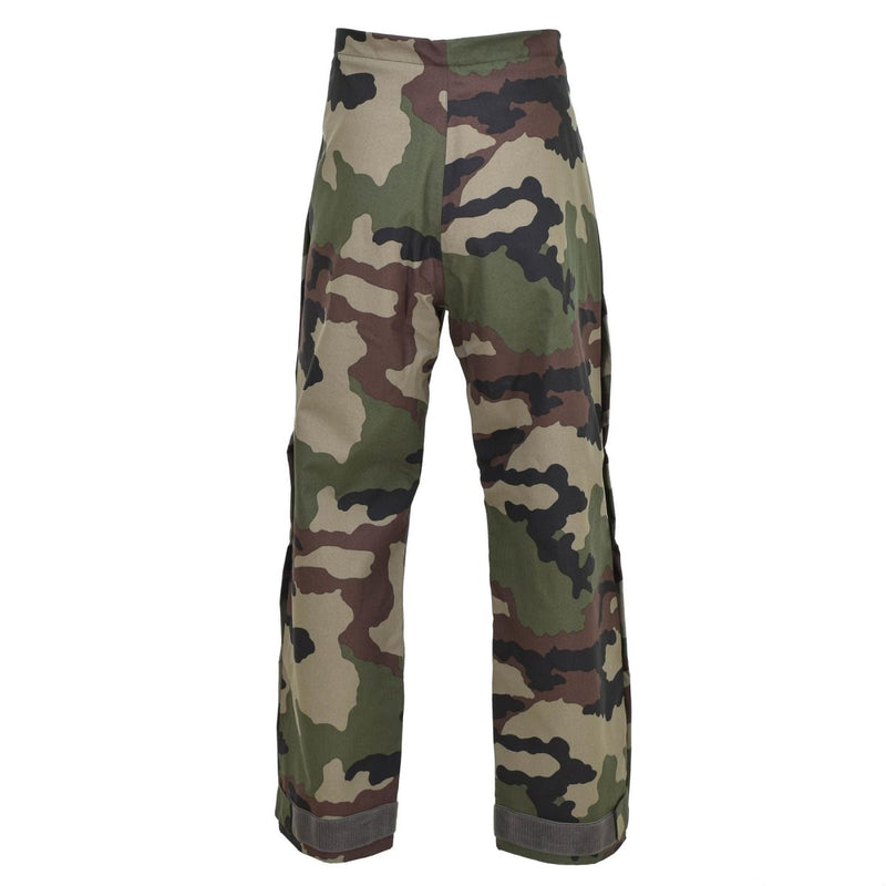 Original French military rain pants in CCE camo, waterproof trilaminate material with braces for outdoor protection.