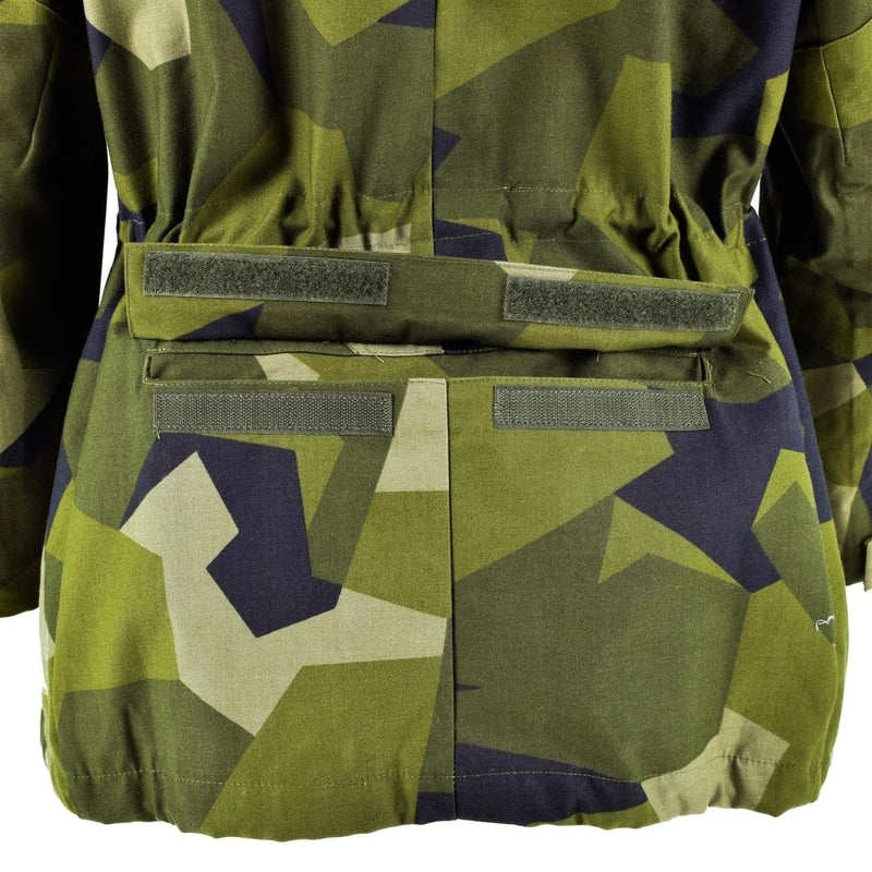 Close-up of the adjustable waist and splinter camouflage pattern on the Swedish army M90 military jacket