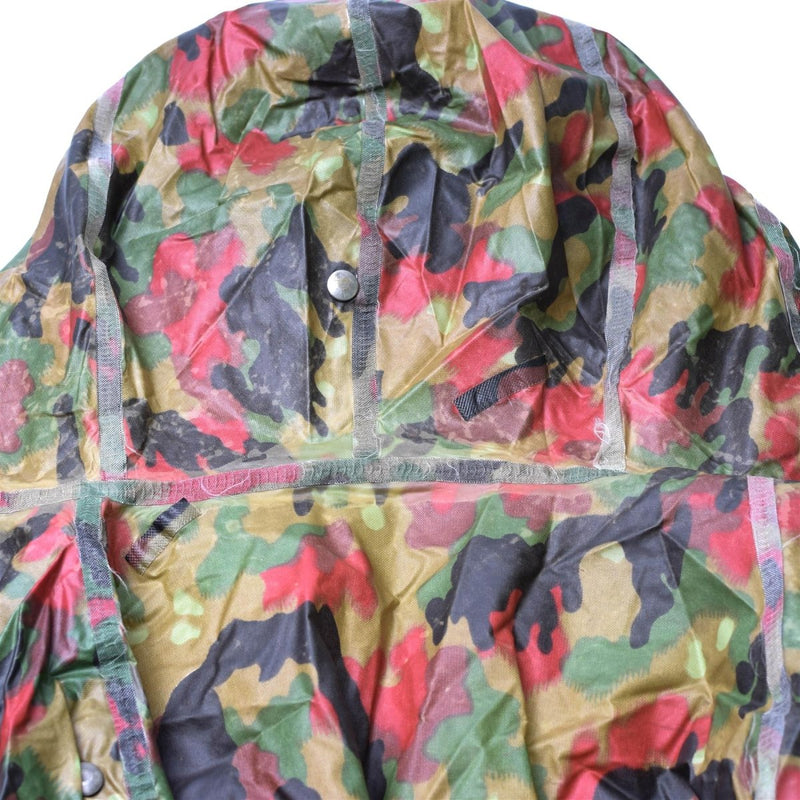 Swiss Alpenflage tactical plastic poncho with camo pattern, durable and water-resistant for outdoor use.