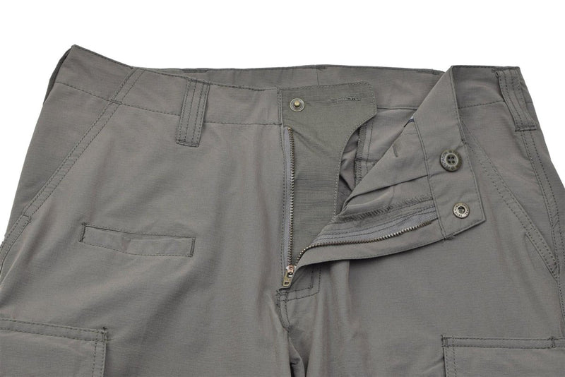 Close-up of grey Pentagon BDU 2.0 Tropic Pants showing zipper, button fly, and multiple pockets.