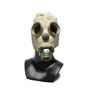 Vintage Polish MP3 gas mask from the 1970s with round eye lenses and front filter attachment on display bust.