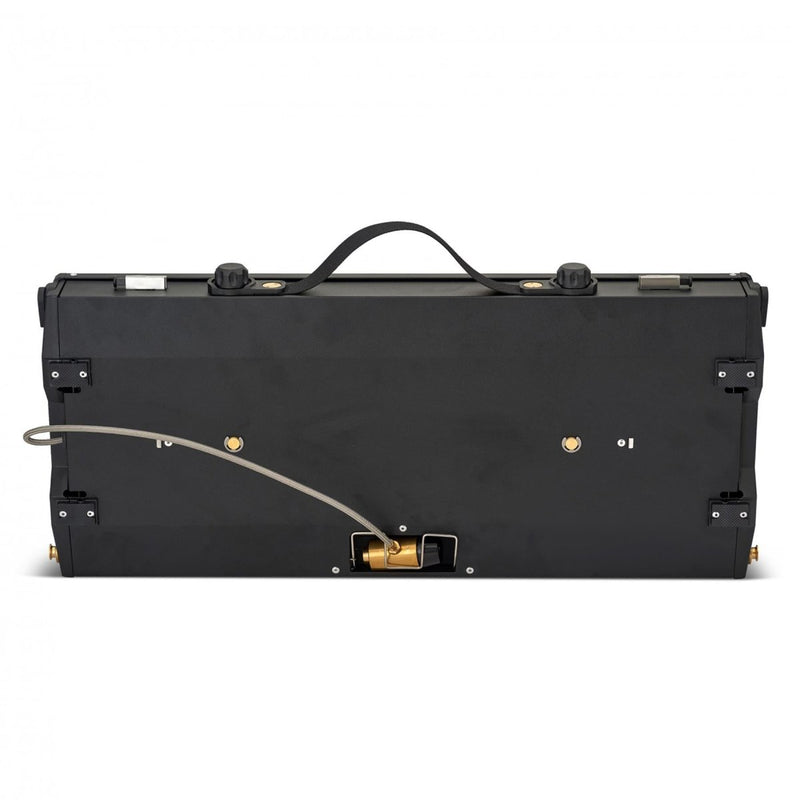 Folded Primus Alika portable dual burner outdoor camping stove with handle and gas connection hose visible