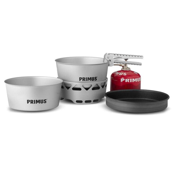 Primus Essential Stove Set with 1.3L pot, pan, and compact lightweight camping gas stove for outdoor cooking.