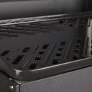 Close-up of the black non-stick metal grill surface of the Primus Kuchoma portable camping BBQ stove.