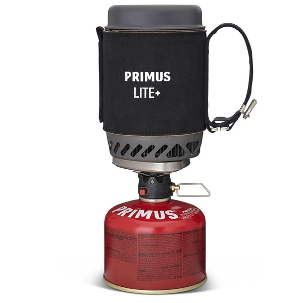 Primus Lite Plus lightweight camping stove with ceramic coated pot and fuel canister for hiking and outdoor cooking.