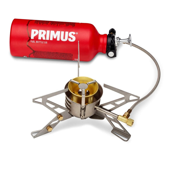 Primus MultiFuel III hiking stove with red fuel bottle, compact portable design for outdoor camping and multi-fuel use