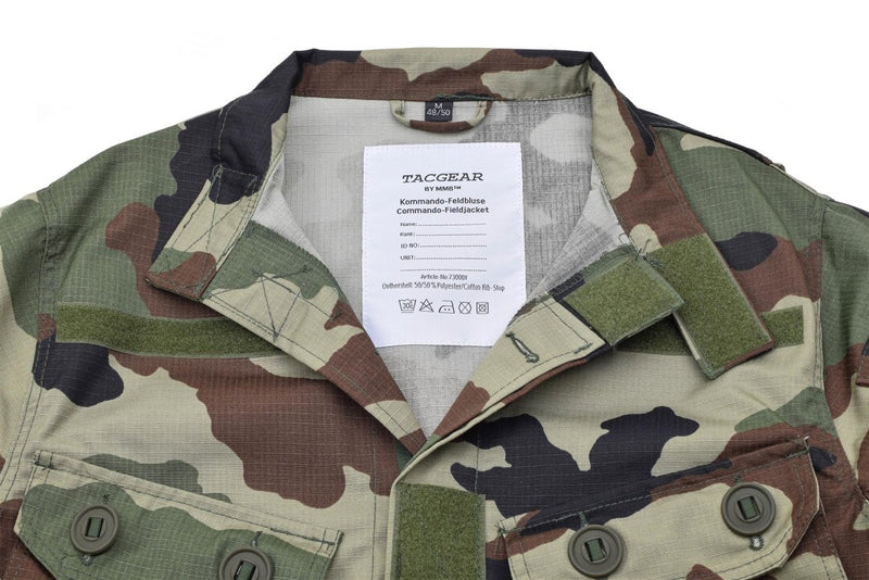 Close-up of TACGEAR French military camo commando jacket with button and hook-and-loop fasteners on chest pockets.